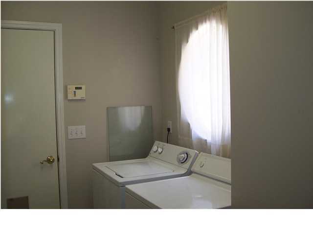 254 Ridge Lake Road Crestview, FL 32536 - Photo 29 of 29 a bathroom with a toilet sink and window