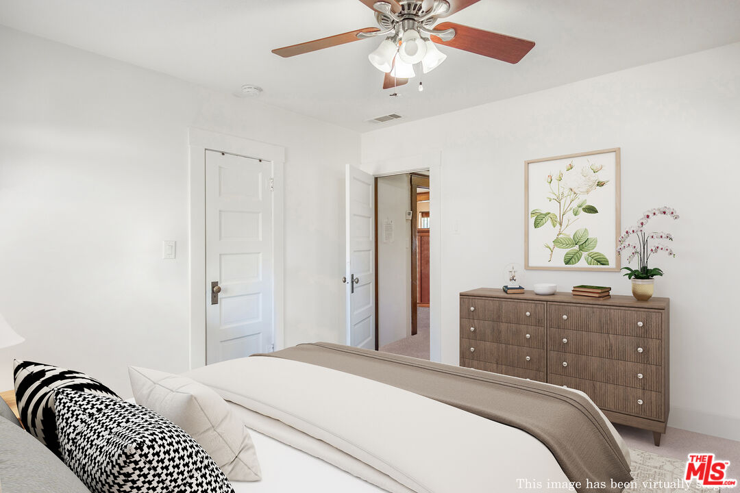 2715 Cridge Street Riverside, CA 92507 - Photo 18 of 25 a bedroom with a bed and a dresser