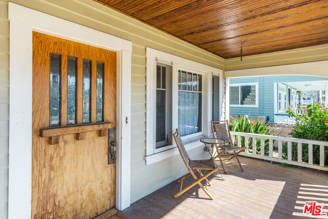 2715 Cridge Street Riverside, CA 92507 - Photo 3 of 25 a balcony with furniture and wooden floor