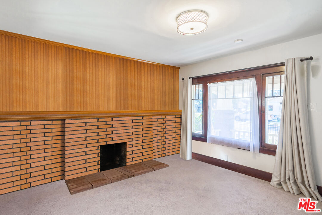 2715 Cridge Street Riverside, CA 92507 - Photo 4 of 25 an empty room with windows