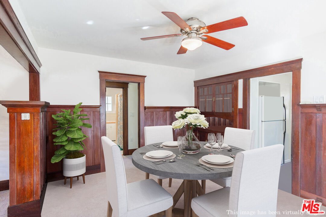 2715 Cridge Street Riverside, CA 92507 - Photo 9 of 25 a view of a dining room with furniture and a potted plant