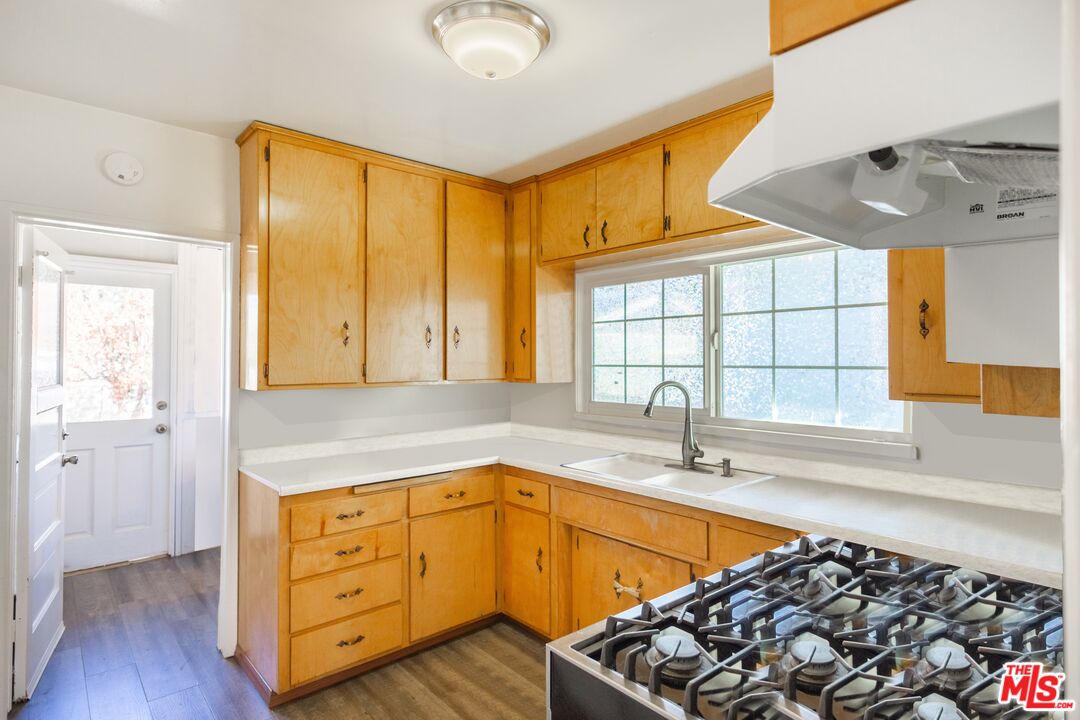 2715 Cridge Street Riverside, CA 92507 - Photo 10 of 25 a kitchen with stainless steel appliances granite countertop a sink a stove and a refrigerator