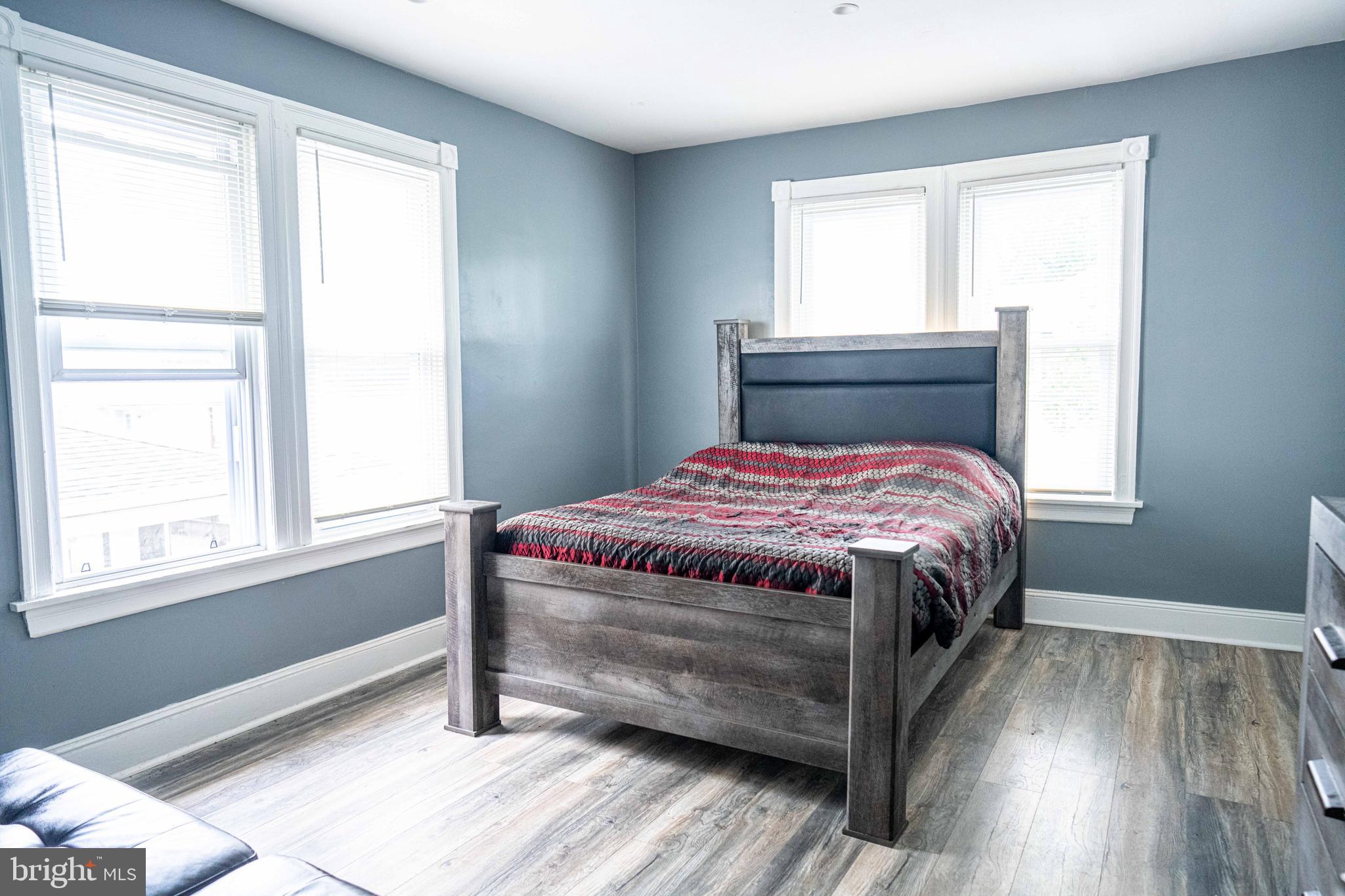 51 Lewis Avenue, Unit A Lansdowne, PA 19050 - Photo 20 of 28 a bedroom with a bed and a window