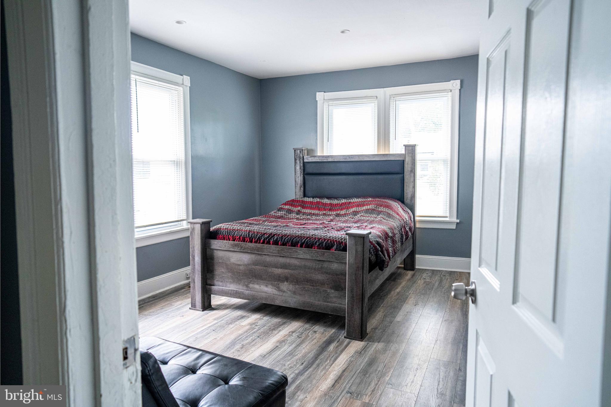 51 Lewis Avenue, Unit A Lansdowne, PA 19050 - Photo 21 of 28 a bedroom with a bed and a window