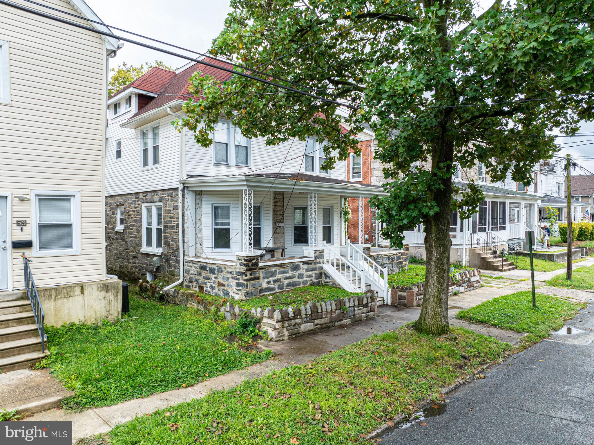 51 Lewis Avenue, Unit A Lansdowne, PA 19050 - Photo 7 of 28 a view of a house with a yard and sitting area