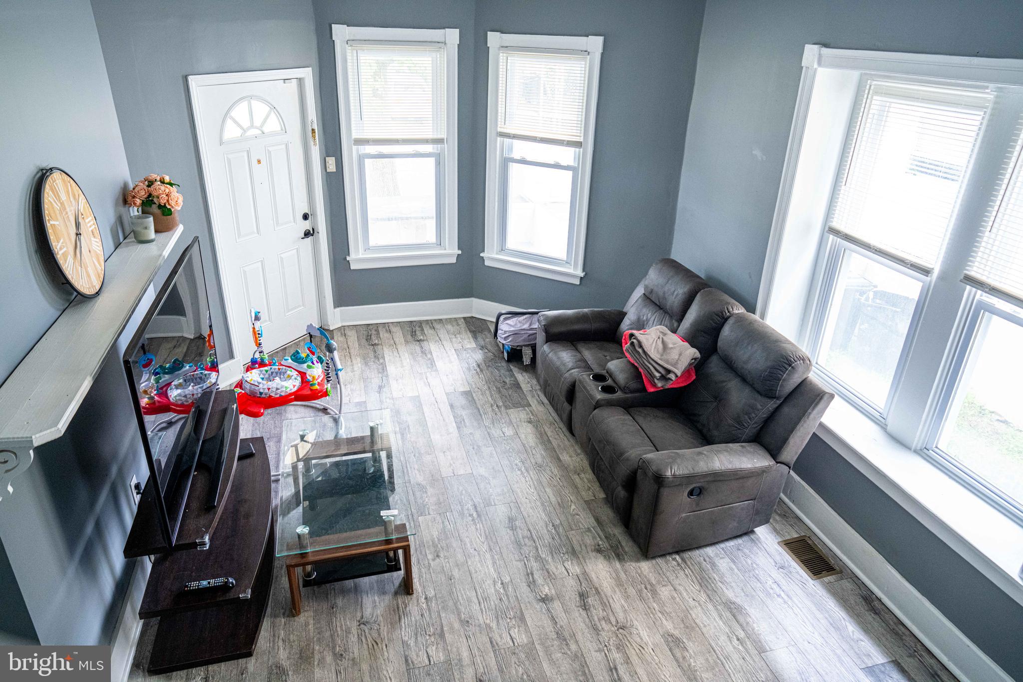 51 Lewis Avenue, Unit A Lansdowne, PA 19050 - Photo 9 of 28 a living room with furniture and a window
