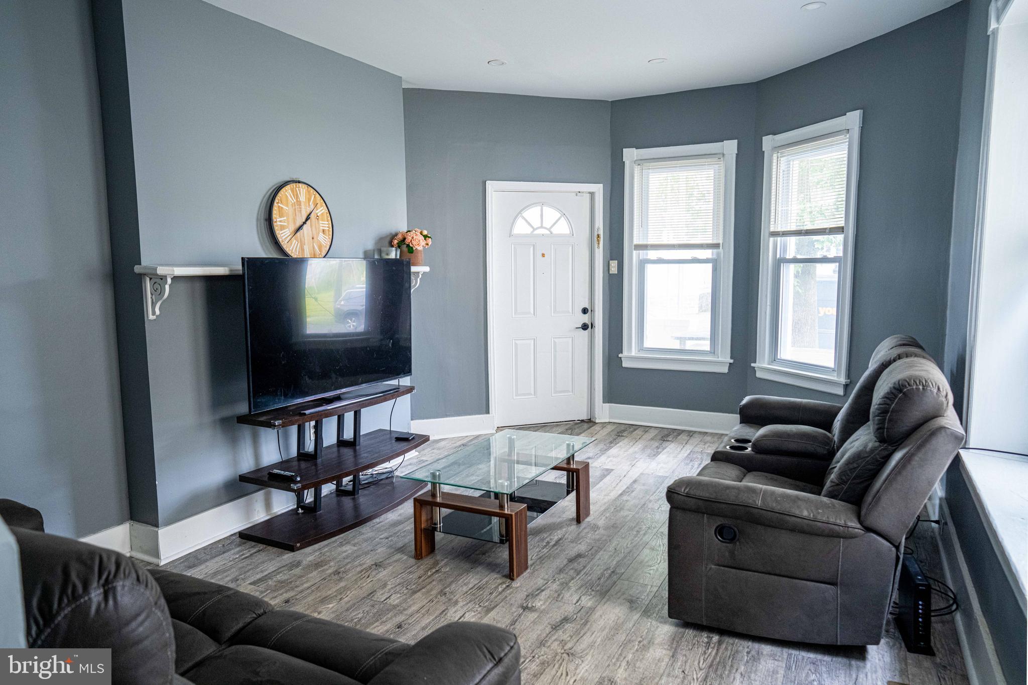 51 Lewis Avenue, Unit A Lansdowne, PA 19050 - Photo 10 of 28 a living room with furniture and a flat screen tv