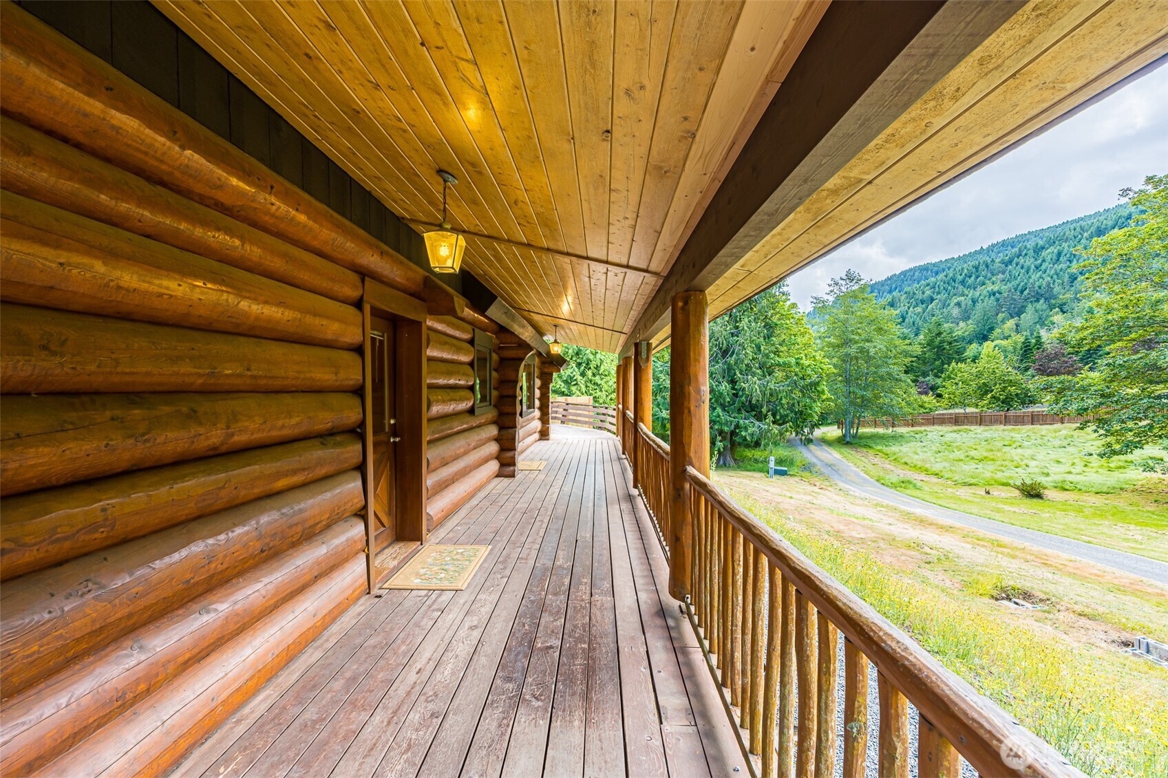 1422 Grauel-Ramapo Road Port Angeles, WA 98363 - Photo 24 of 40 a view of balcony with wooden floor and outdoor space