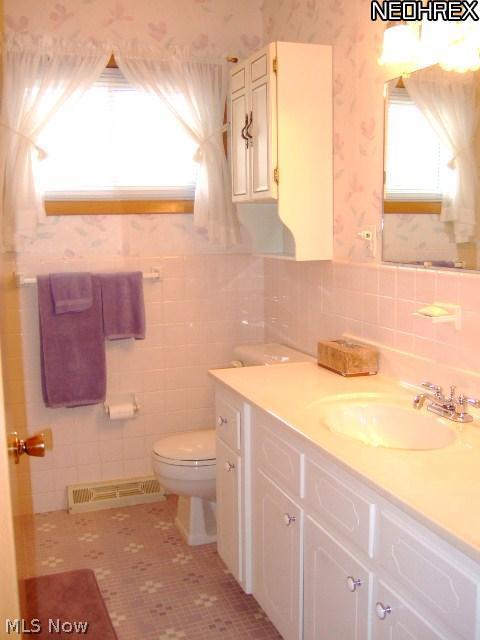 13634 Carpenter Road Garfield Heights, OH 44125 - Photo 11 of 24 Can you say "sparkling"? The main bath is sparking clean boasting a large vanity and beautiful tiles in great condition! The tub and shower combination boasts a maintenance free tub/shower surround!
