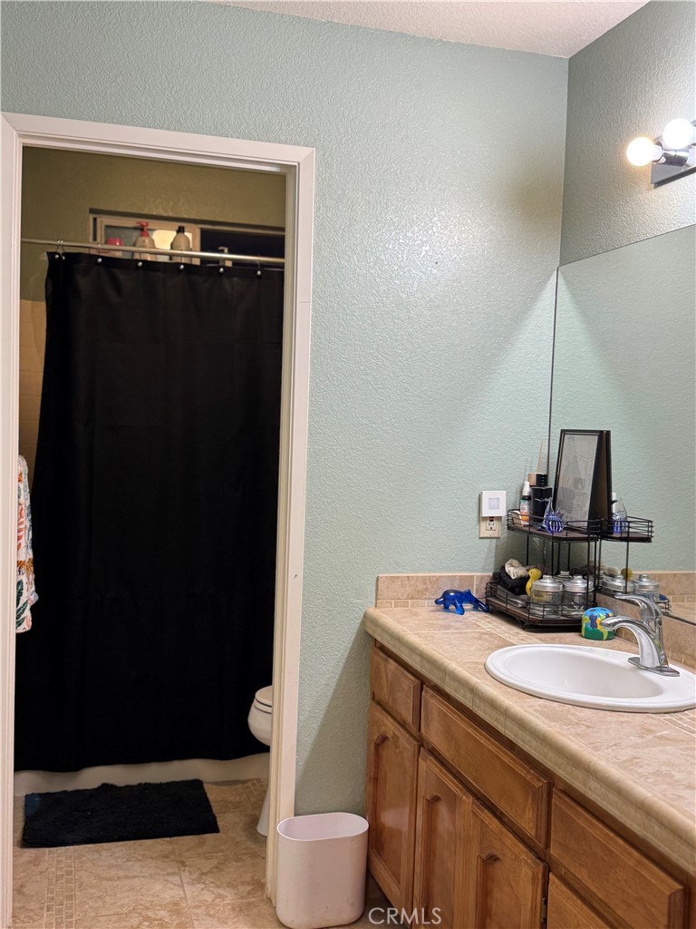 8220 Marek Road Los Molinos, CA 96055 - Photo 18 of 27 a bathroom with a sink and a mirror