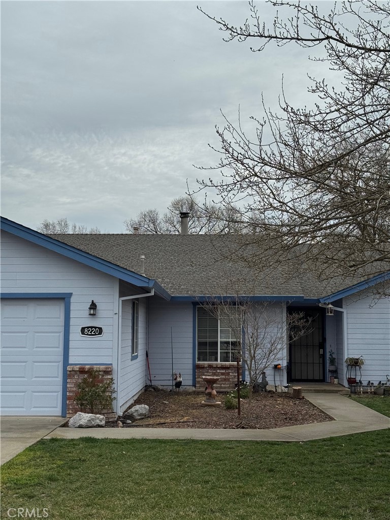 8220 Marek Road Los Molinos, CA 96055 - Photo 4 of 27 a front view of a house with garden