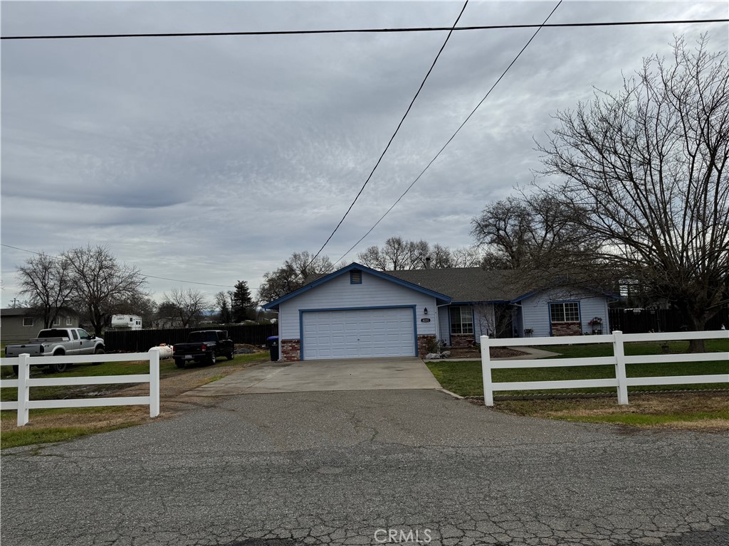 8220 Marek Road Los Molinos, CA 96055 - Photo 5 of 27 a view of a house with a fence