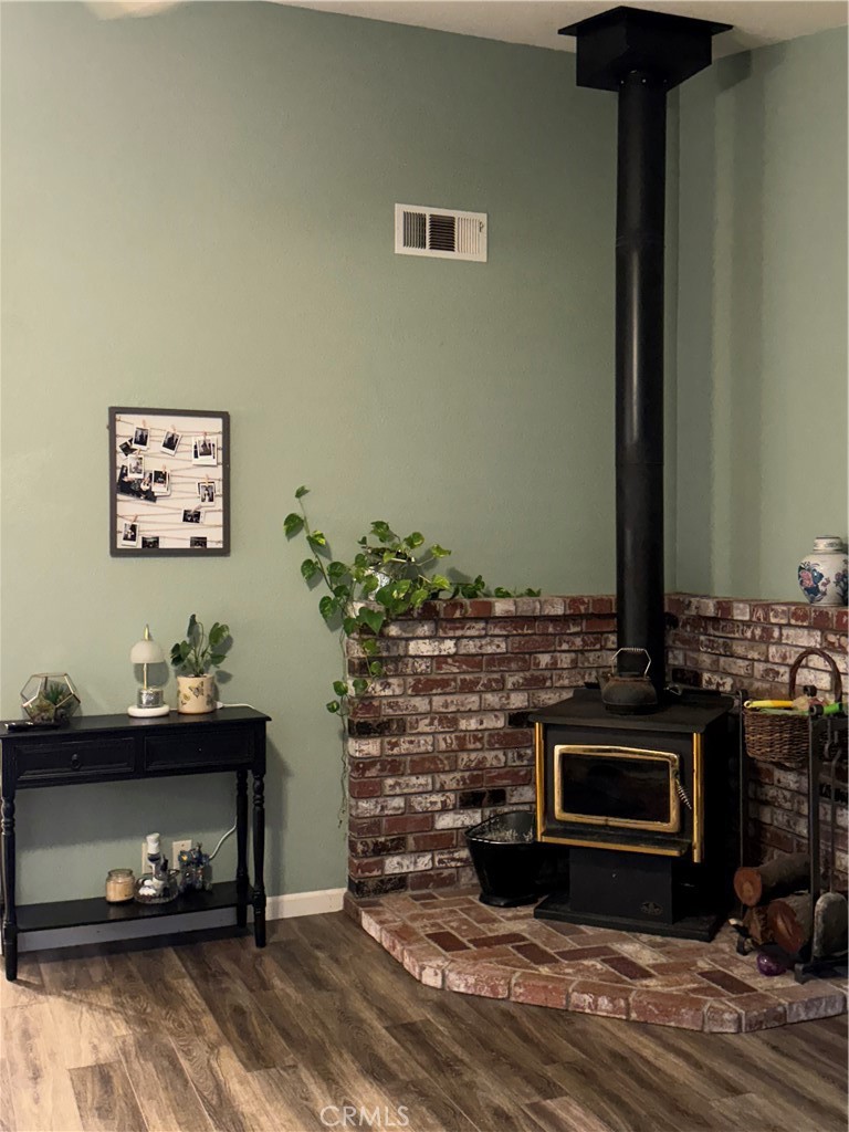 8220 Marek Road Los Molinos, CA 96055 - Photo 9 of 27 a living room with furniture and a fireplace