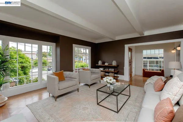 a kitchen with stainless steel appliances granite countertop a stove and a wooden floors