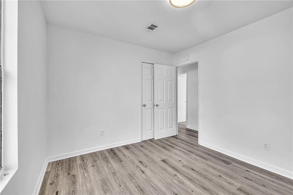 3959 Wood Path Drive Stone Mountain, GA 30083 - Photo 23 of 37 a view of an empty room with wooden floor