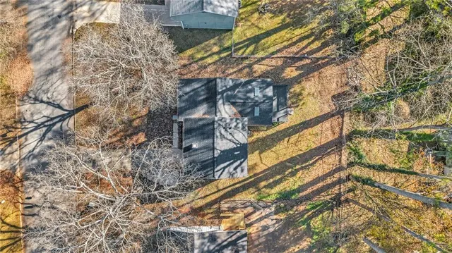 a view of wooden house with a snow
