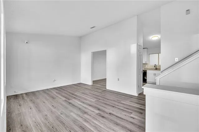 a view of a livingroom with wooden floor