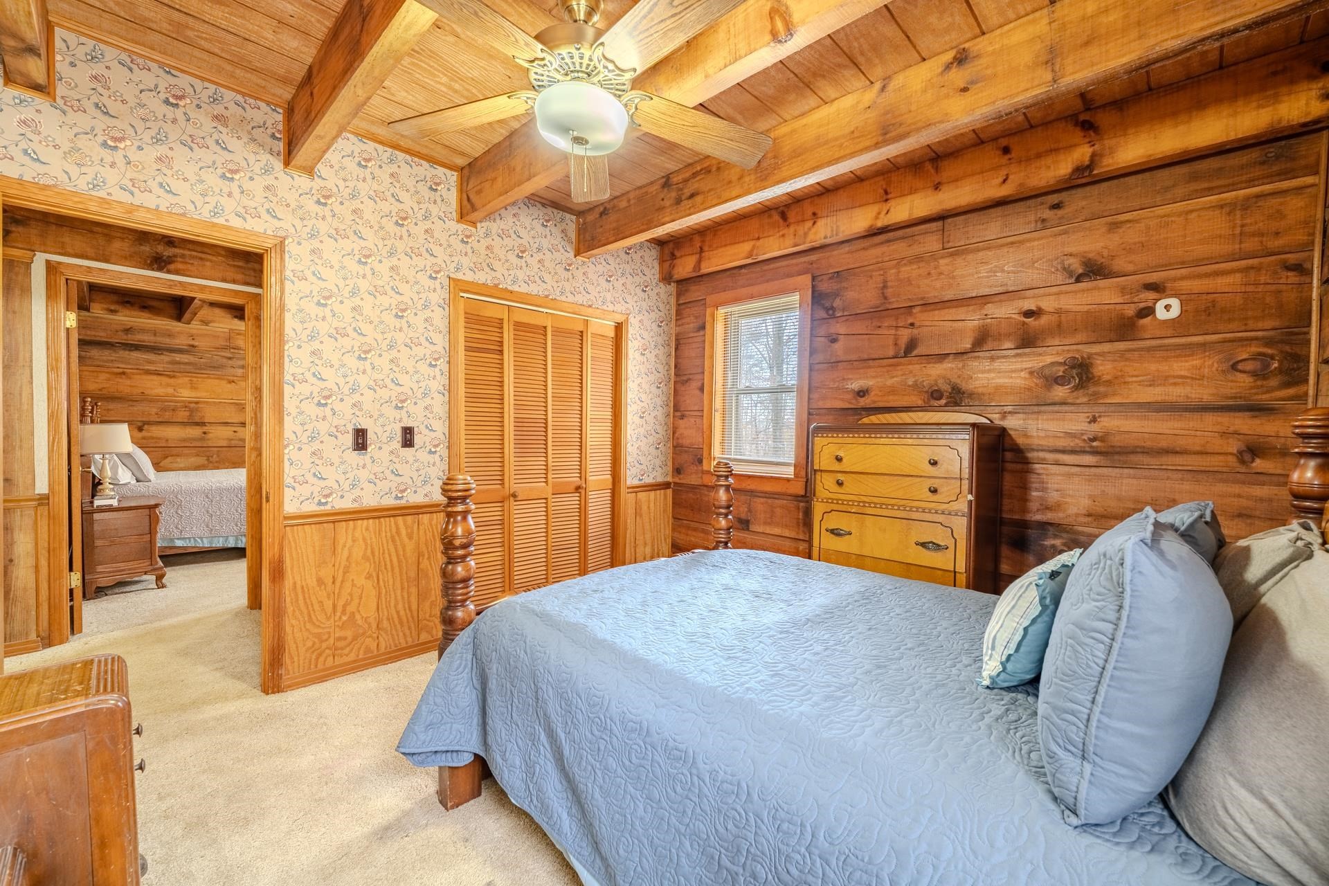 165 Cr 321 Road Iuka, MS 38852 - Photo 14 of 40 a bedroom with a bed and a chandelier