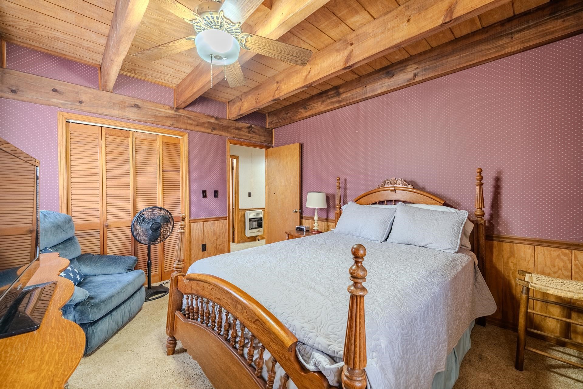 165 Cr 321 Road Iuka, MS 38852 - Photo 17 of 40 a bed room with a bed and a chandelier