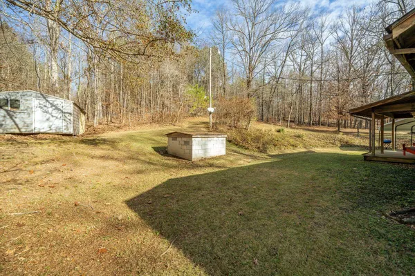 a view of a yard with an outdoor space