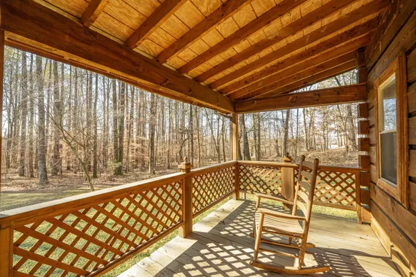 a view of balcony with wooden floor