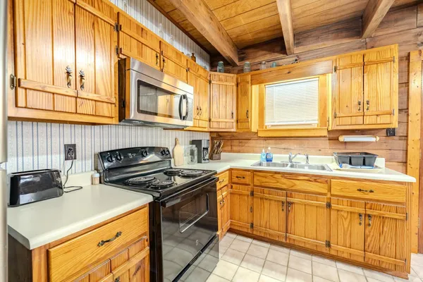 a kitchen with stainless steel appliances granite countertop a stove and a sink