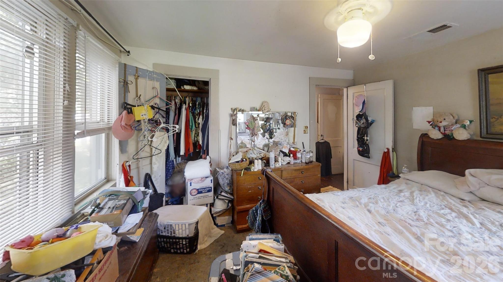 21 Maple Avenue Candler, NC 28715 - Photo 19 of 28 a bed room with a bed and a window