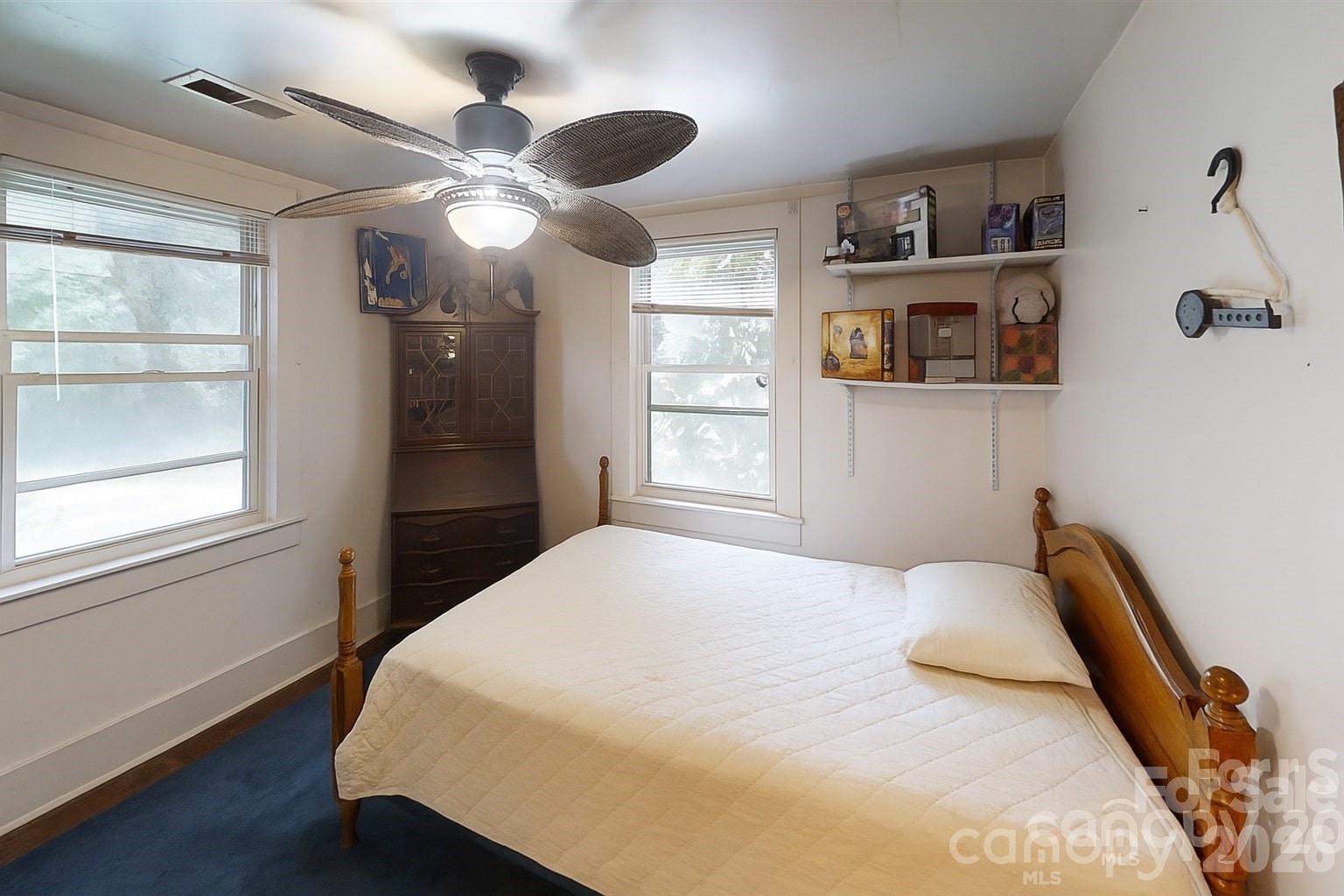 21 Maple Avenue Candler, NC 28715 - Photo 21 of 28 a bedroom with a bed and a large window