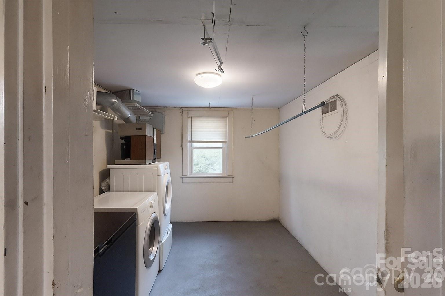 21 Maple Avenue Candler, NC 28715 - Photo 28 of 28 a room that has a couch and a window in it