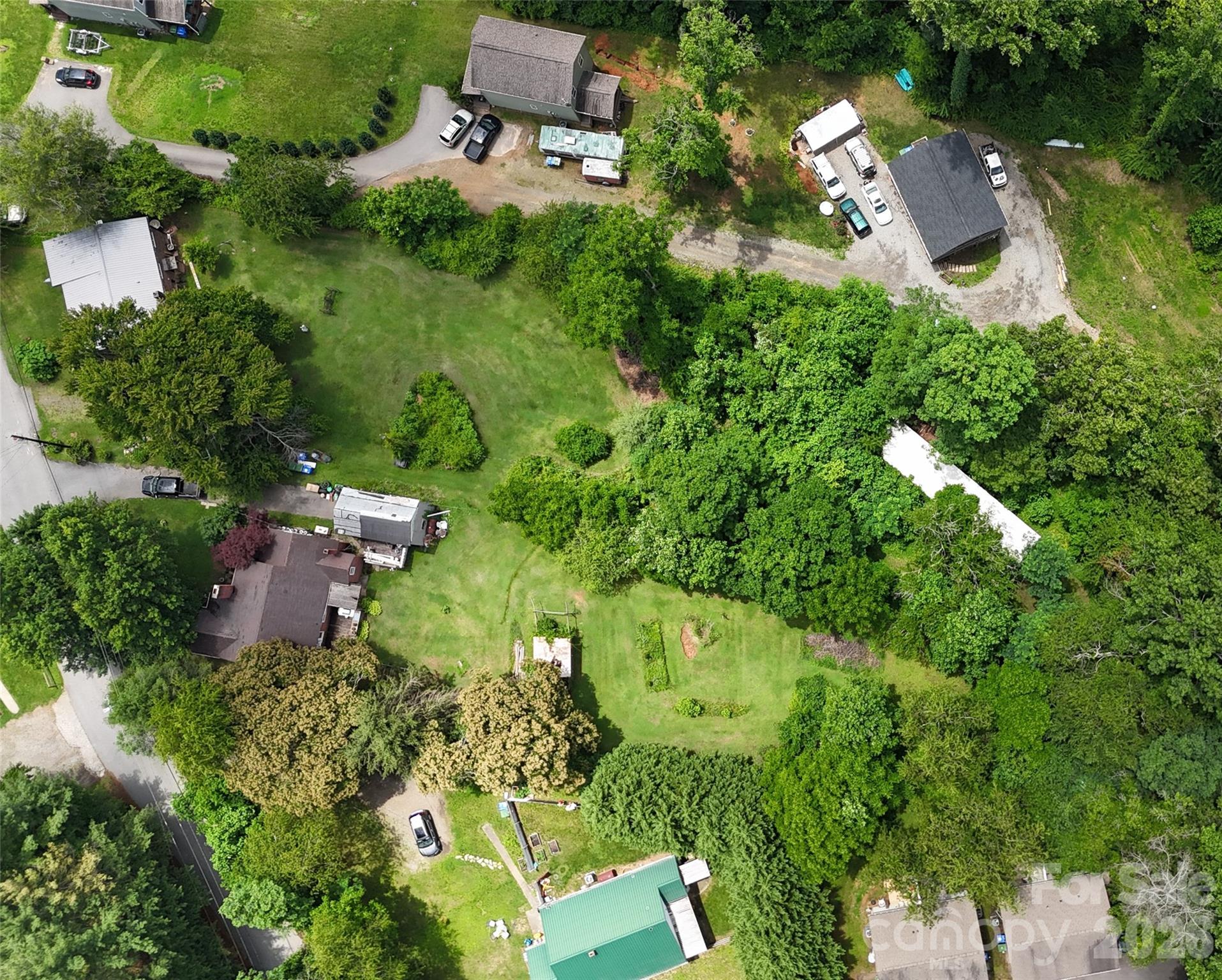 21 Maple Avenue Candler, NC 28715 - Photo 4 of 28 an aerial view of residential house with outdoor space and swimming pool