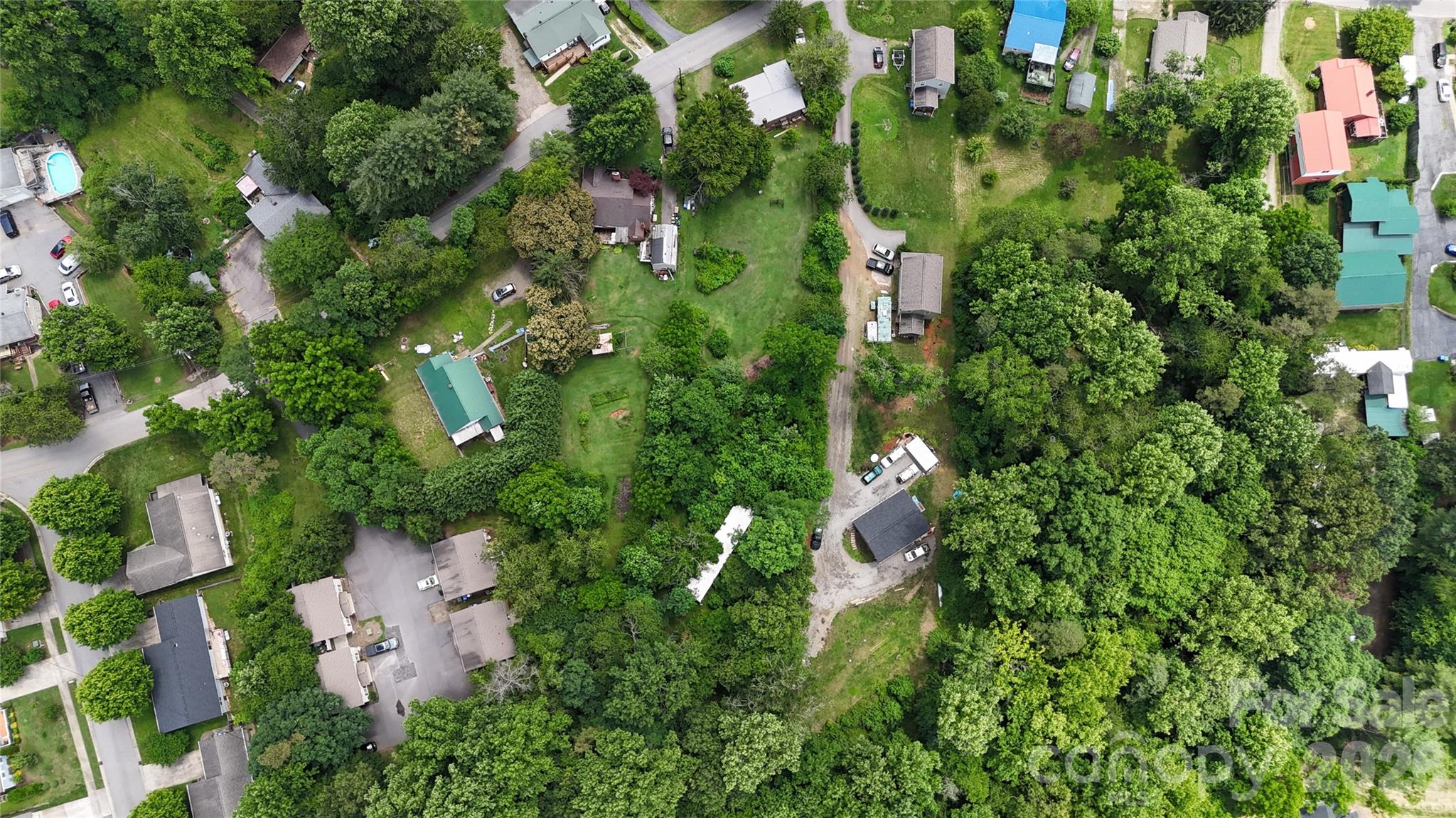 21 Maple Avenue Candler, NC 28715 - Photo 5 of 28 an aerial view of residential house with outdoor space and trees all around