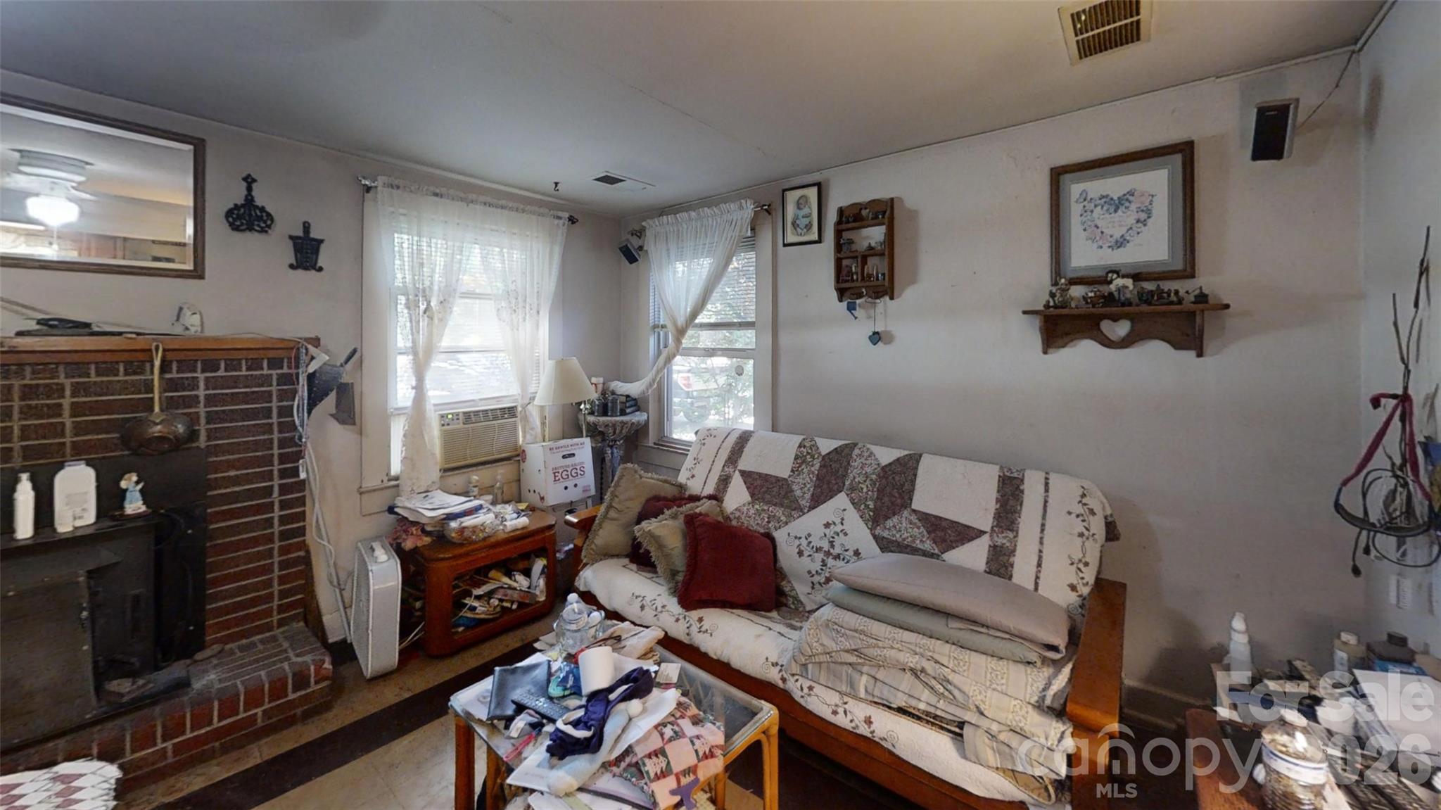 21 Maple Avenue Candler, NC 28715 - Photo 7 of 28 a living room with furniture and a flat screen tv