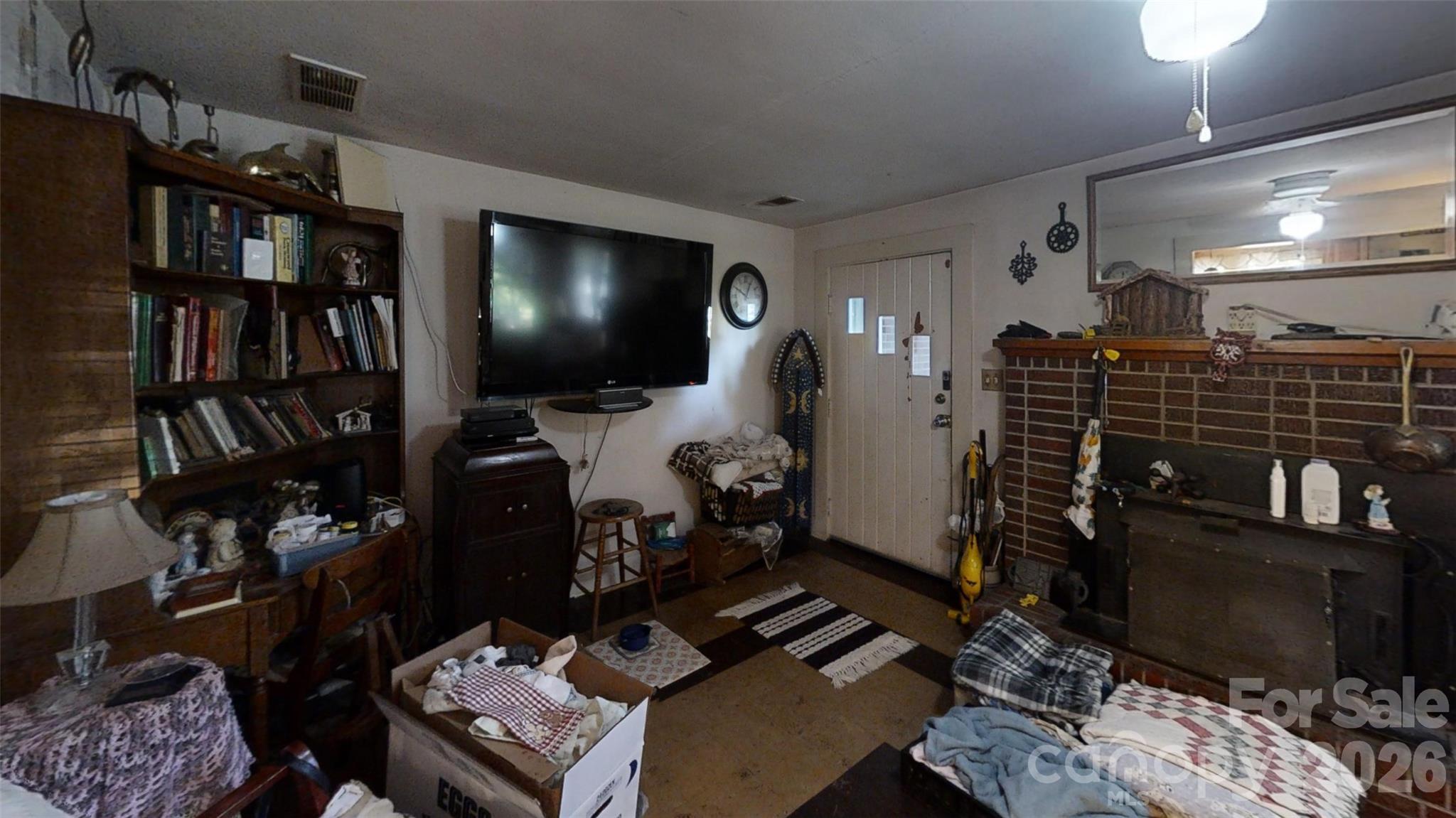 21 Maple Avenue Candler, NC 28715 - Photo 8 of 28 a living room with furniture and a flat screen tv