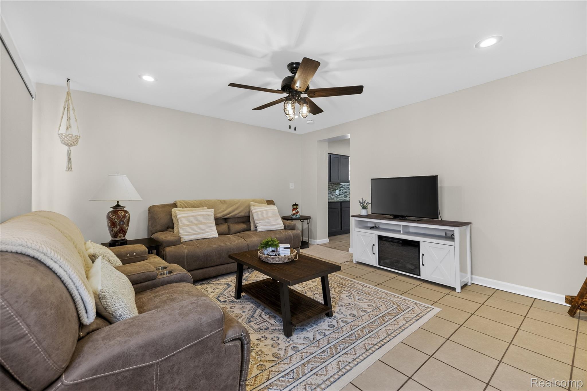 826 Goddard Road Wyandotte, MI 48192 - Photo 16 of 39 Recessed ceiling lighting, ceiling fan light fixture, light-toned wall paint, neutral tile flooring, and a defined entryway