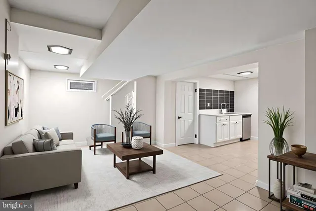 a living room with furniture and white walls