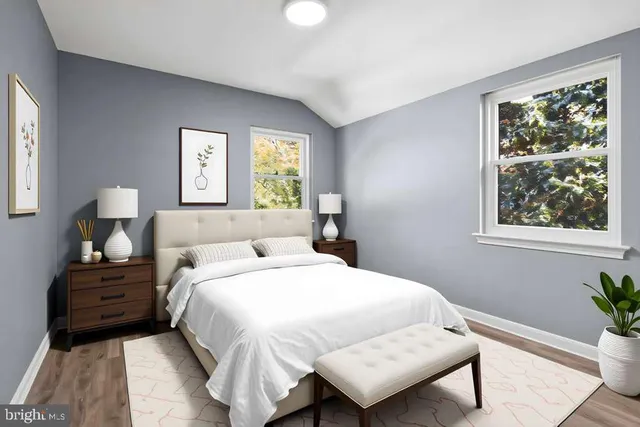 a bedroom with a bed and window