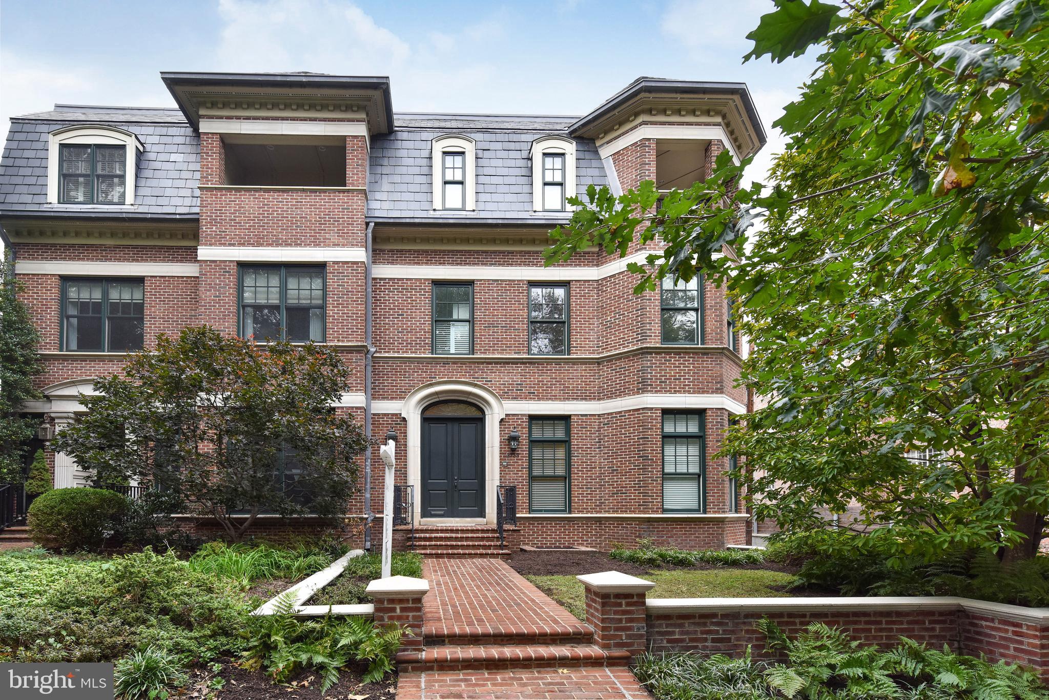 2733 Cathedral Avenue Northwest Washington, DC 20008 - Photo 1 of 10 a front view of a house with a yard