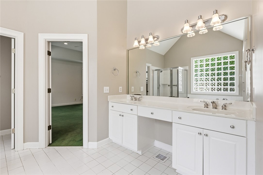 110 Garden Gate Drive Anderson, SC 29621 - Photo 20 of 35 Bright and airy, this bathroom offers dual sinks and a large mirror, enhancing daily routines.