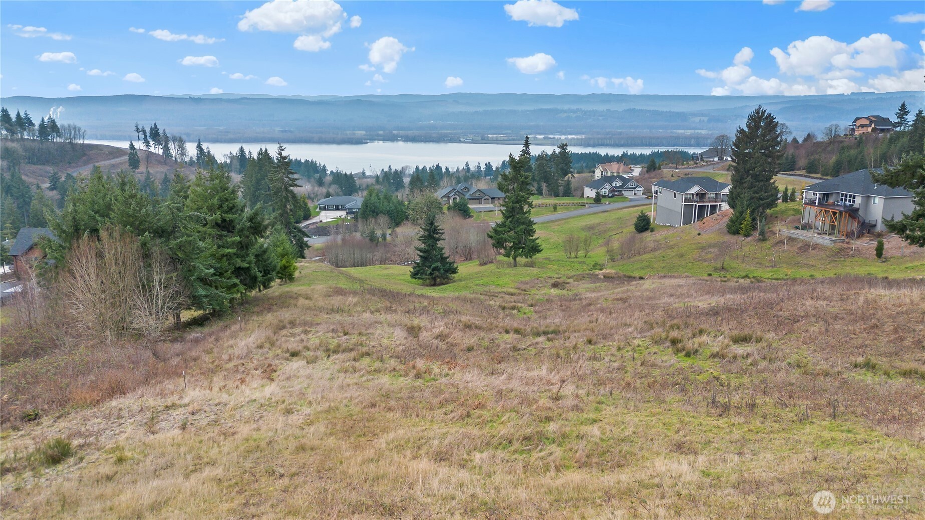 202 Windy River Road Kalama, WA 98625 - Photo 5 of 12 a view of a big yard with an outdoor space