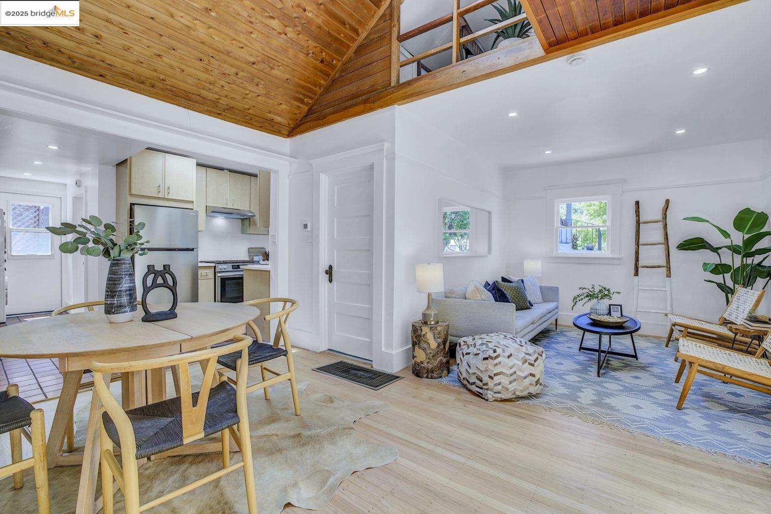 a dining room with furniture and wooden floor