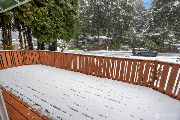 a view of outdoor space with deck and yard