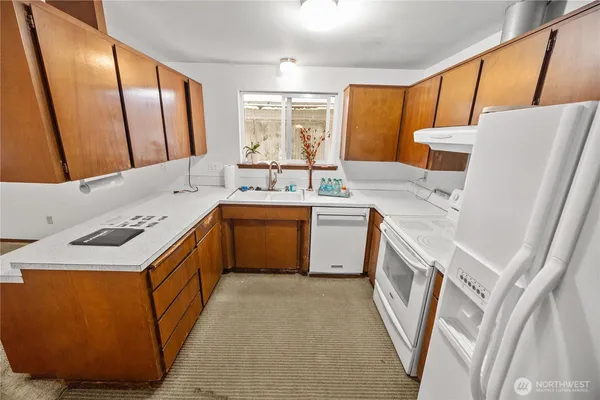 a utility room with a sink a washer and dryer