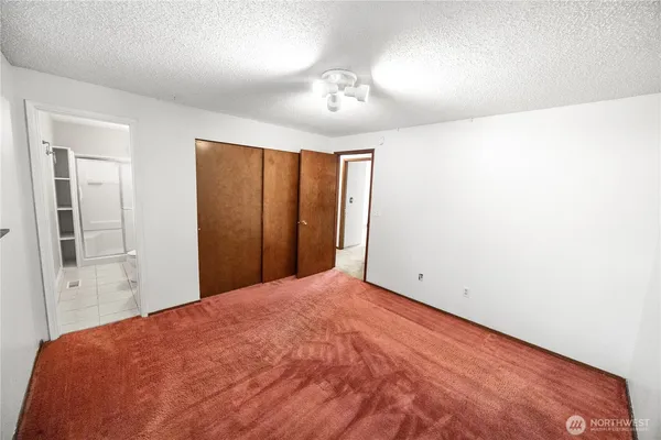 a view of a room with a large bed
