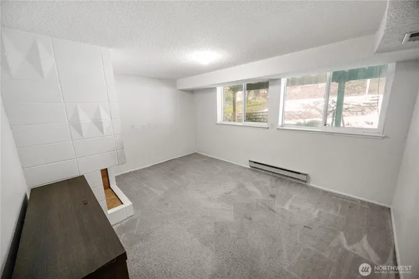 a view of an empty room with a window