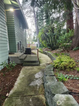 a view of a backyard with sitting area