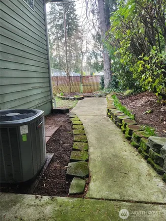 a view of a backyard with pathway
