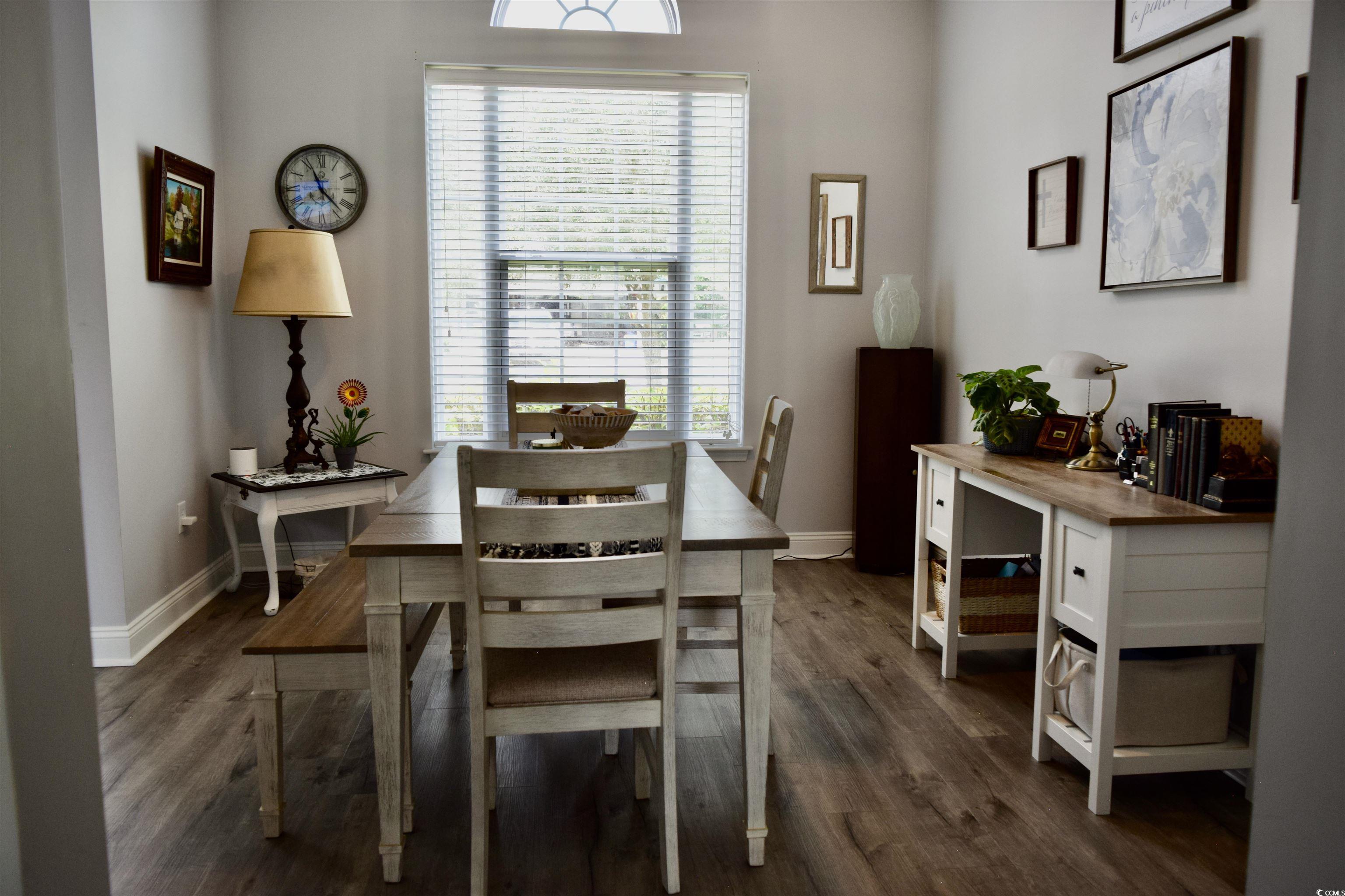 324 Oak Haven Drive Murrells Inlet, SC 29576 - Photo 14 of 38 Dining space with dark wood-style flooring and baseboards