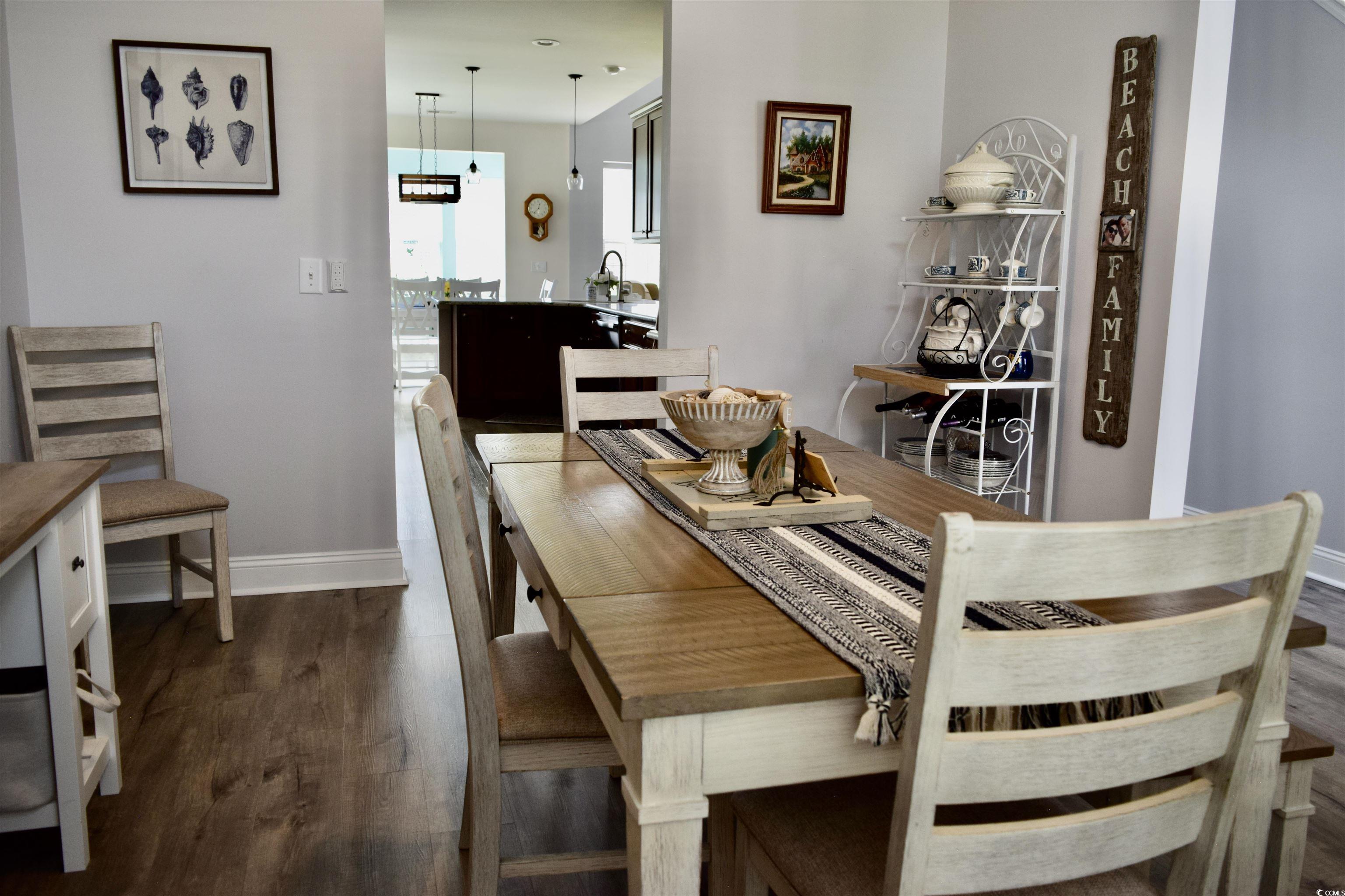 324 Oak Haven Drive Murrells Inlet, SC 29576 - Photo 15 of 38 Dining room with baseboards and dark wood-style flooring