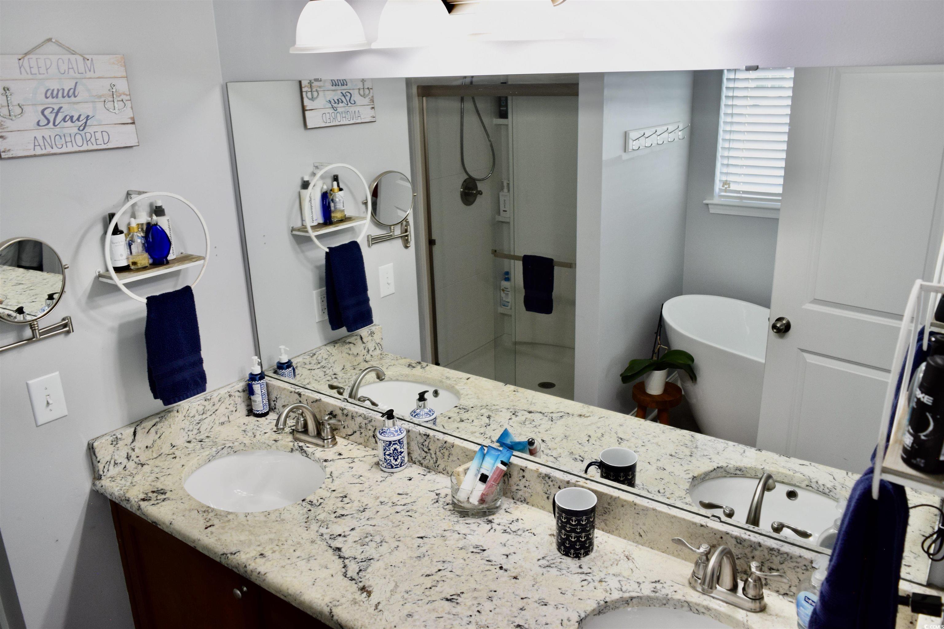324 Oak Haven Drive Murrells Inlet, SC 29576 - Photo 21 of 38 Full bath with a stall shower, double vanity, and a soaking tub