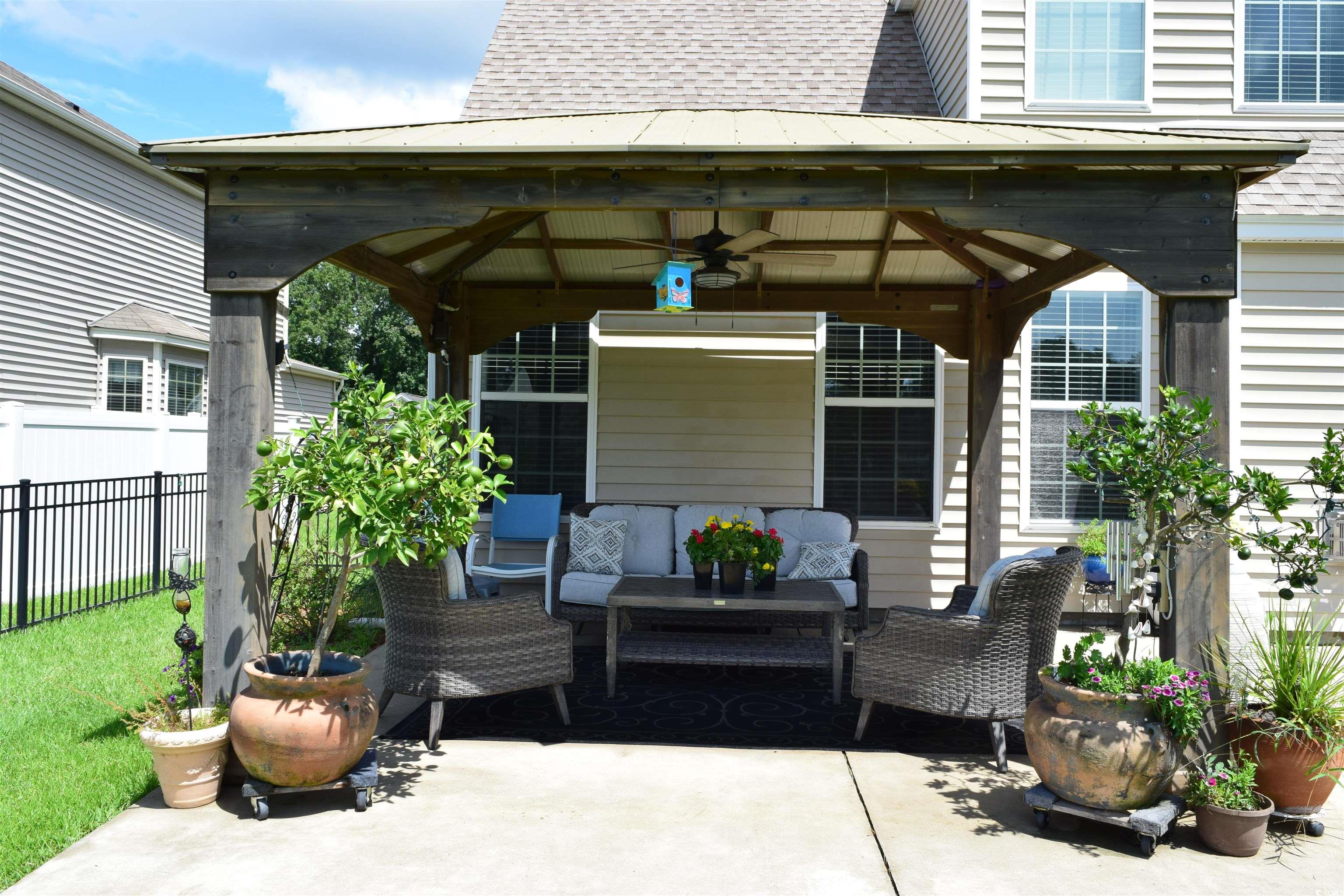 324 Oak Haven Drive Murrells Inlet, SC 29576 - Photo 36 of 38 View of patio with a gazebo, a ceiling fan, and an outdoor hangout area